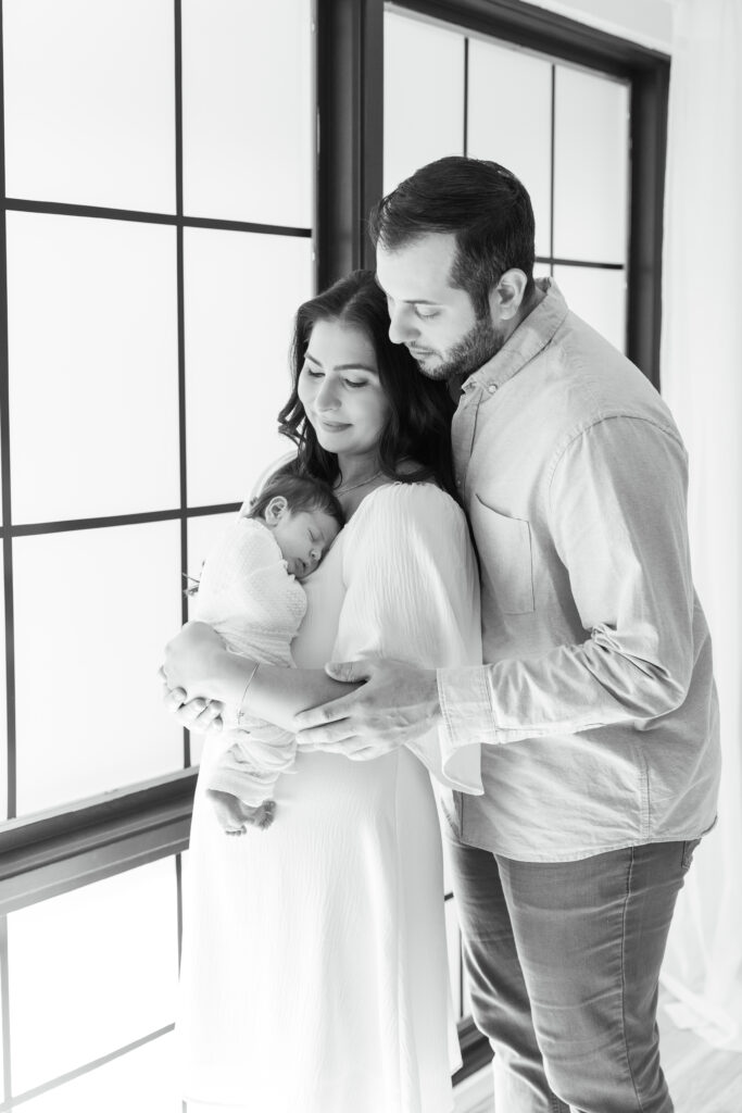 First-time parents holding newborn baby