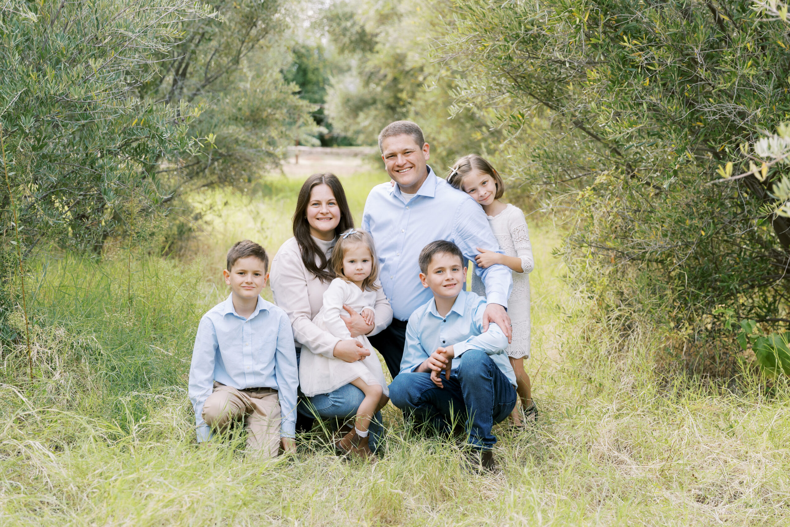 Family smiling during a mini session in Gilbert, Arizona